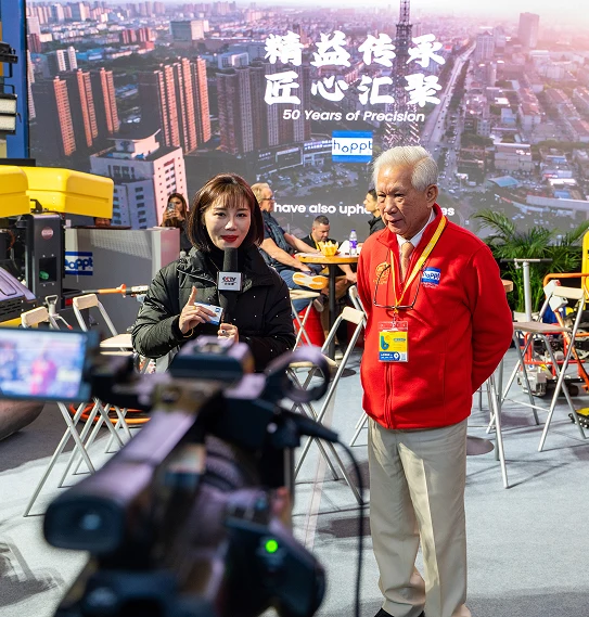 Hoppt founder interviewed by media at the 50 Years of Precision showcase